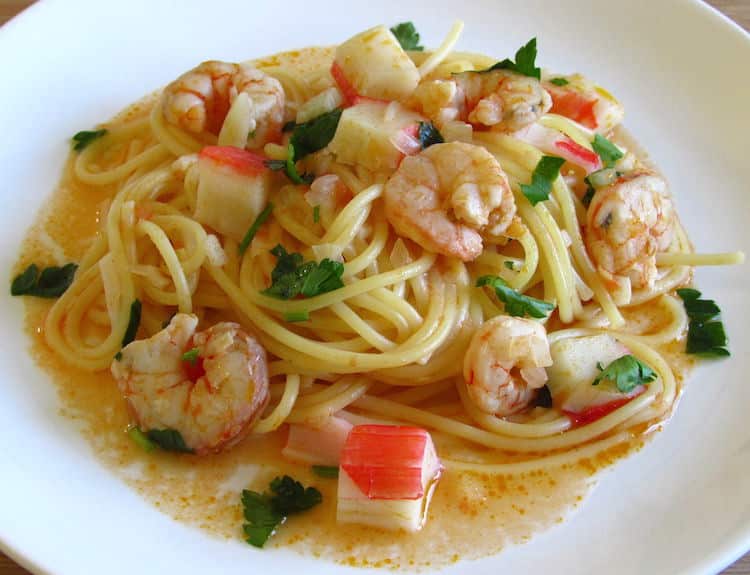 Spaghetti with shrimps and seafood delights on a plate