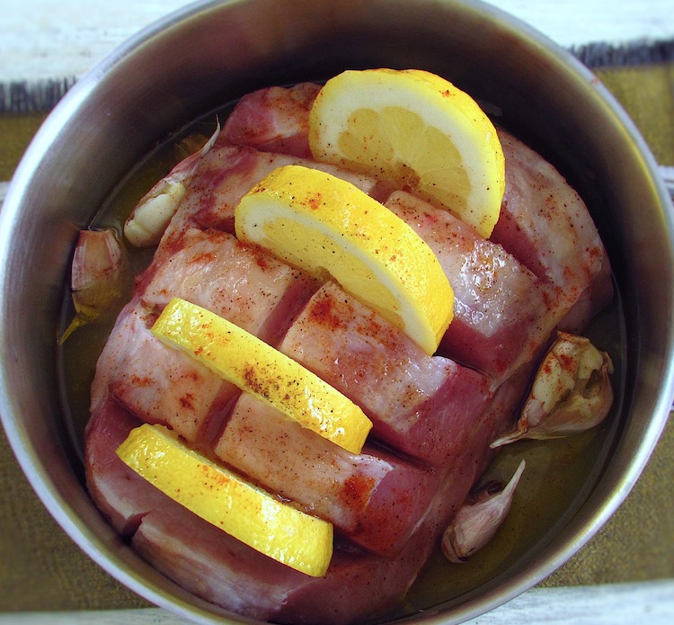Pork loin with lemon and honey on a saucepan