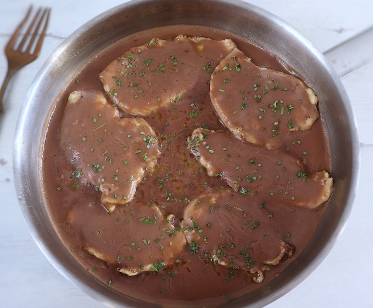 Chicken steaks with coffee sauce on a frying pan