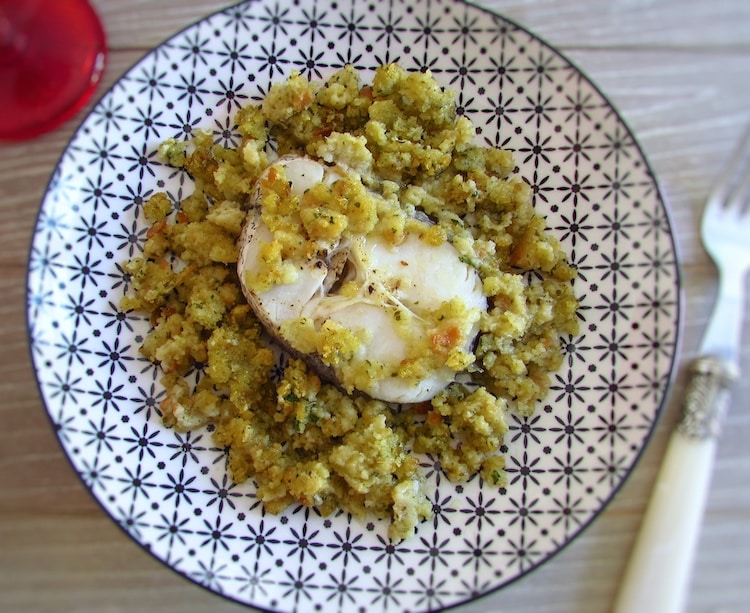 Hake with Portuguese cornbread on a plate