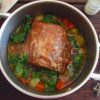 Pork loin with carrot and leek in a saucepan
