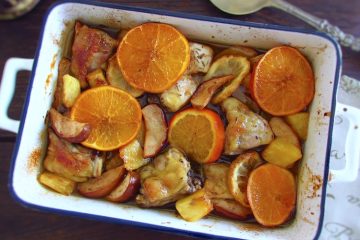 Chicken with fruit on a baking dish