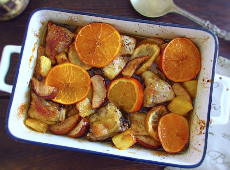 Chicken with fruit on a baking dish