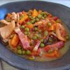 Cuttlefish with peas and carrots on a dish bowl