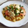 Pasta with monkfish and shrimp on a plate