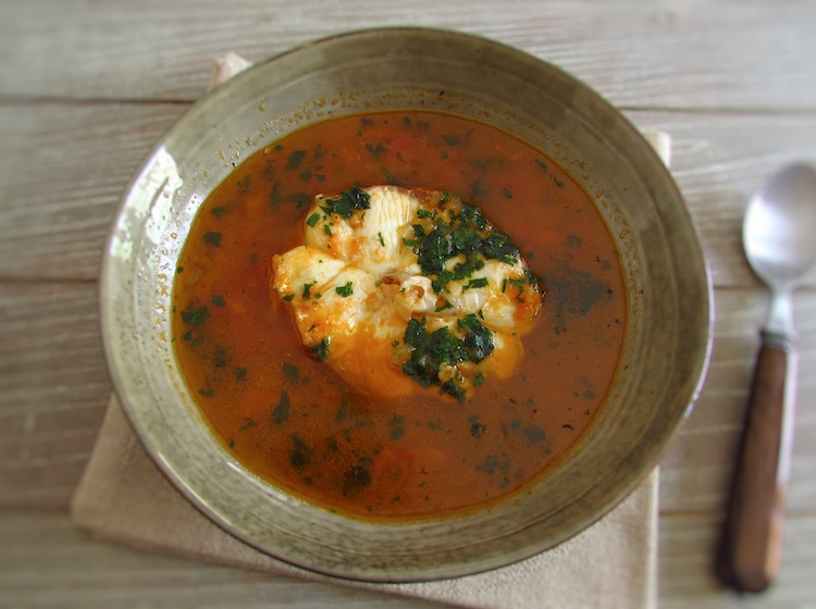 Tomato soup with dogfish on a dish