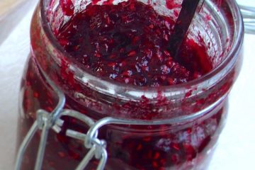 Raspberry jam on a glass jar