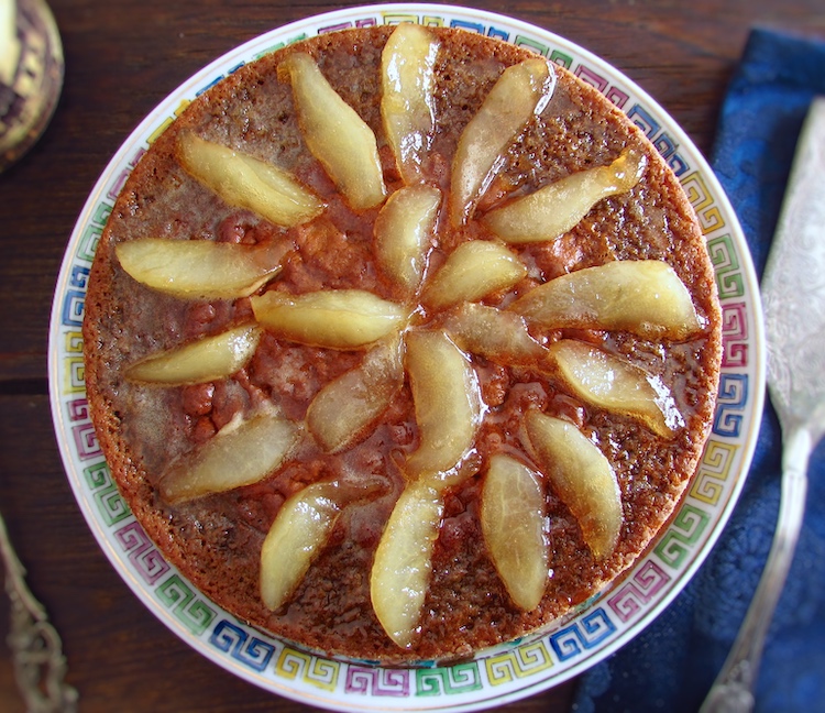 Rosemary cake with caramelized pear on a plate