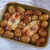 Grouper with potatoes in the oven on a baking dish