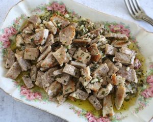 Grilled pork (Assadura à Monchique) on a platter