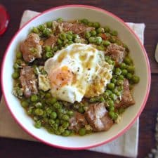 Peas with pork ribs and poached eggs on a bowl
