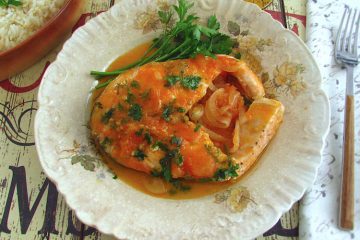 Salmon in tomato sauce on a plate