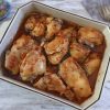 Baked chicken with delicious sauce on a baking dish