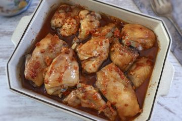 Baked chicken with delicious sauce on a baking dish
