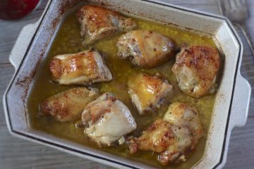 Baked chicken with homemade sauce on a baking dish