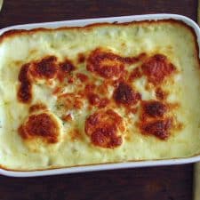 Cod in the oven with egg and béchamel on a baking dish