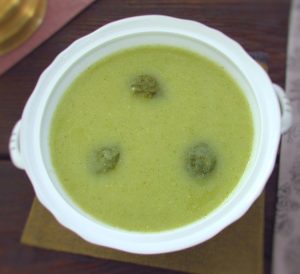 Creamy broccoli soup served on a tureen