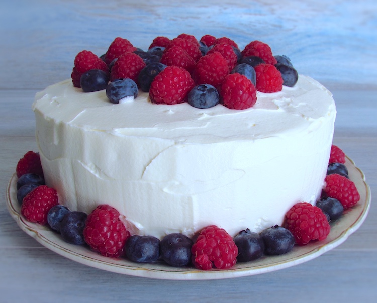 Cake with buttercream and berries on a plate