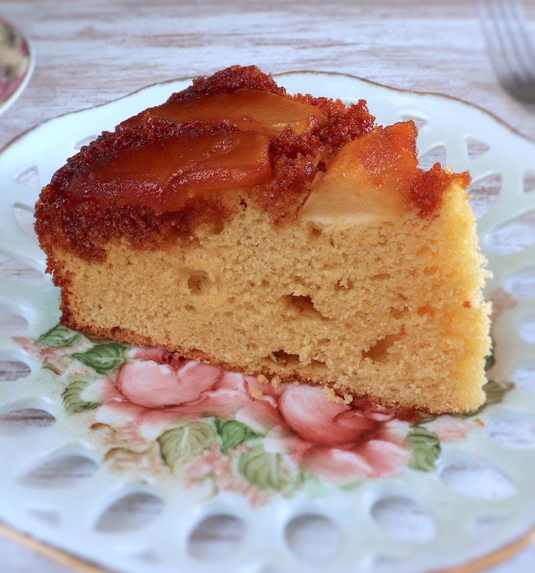Slice of caramel apple upside down cake on a plate