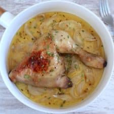 Baked chicken legs with lemon and honey on a dish