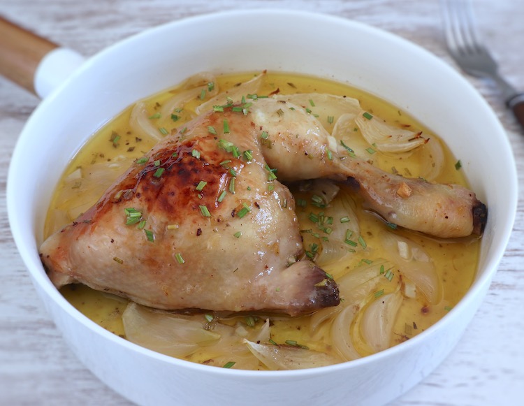 Chicken legs in the oven with lemon and honey on a dish