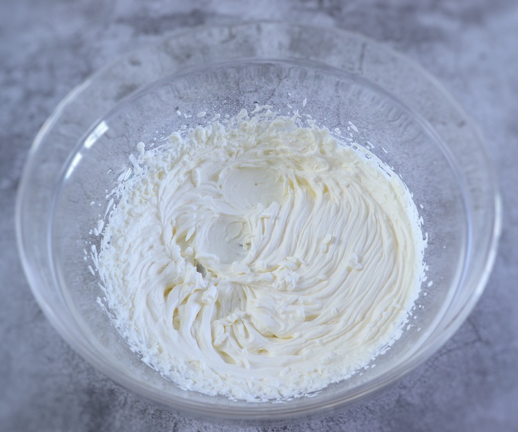 Whipped cream on a large glass bowl