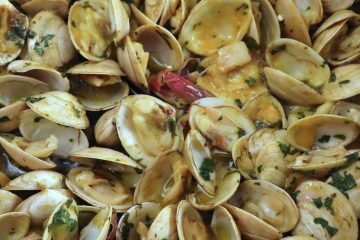 Clams with mustard on a frying pan