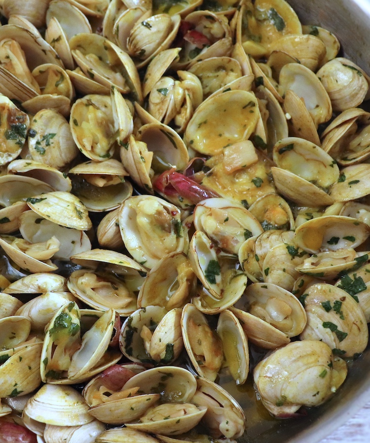 Clams with mustard on a frying pan