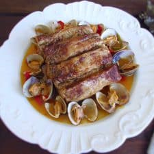 Pork loin with clams on a plate