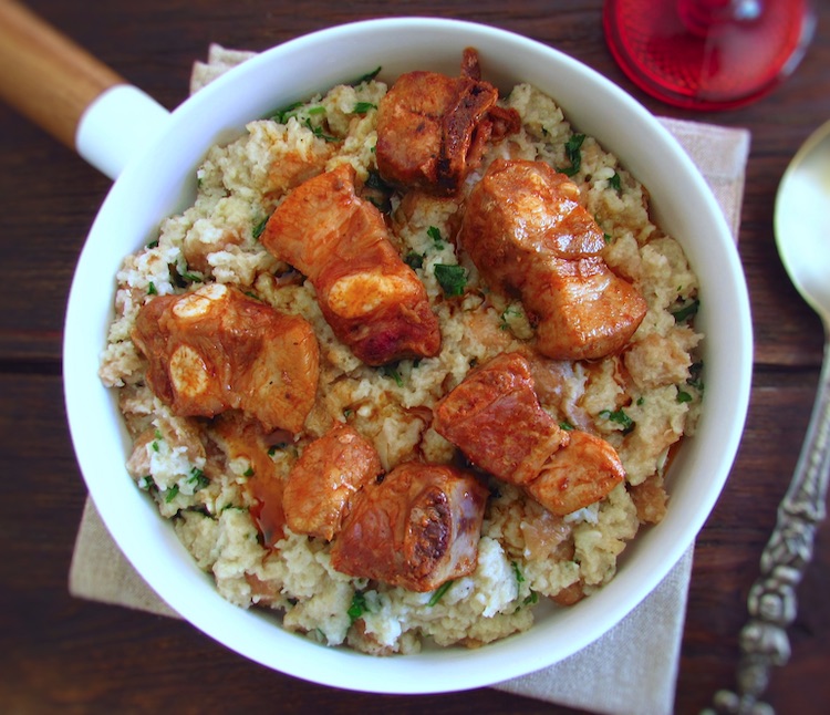 Portuguese migas (crumbs) with pork ribs on a dish bowl