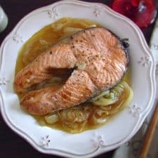 Salmon with onions on a plate
