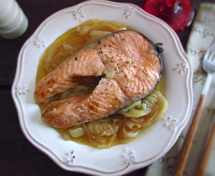 Salmon with onions on a plate