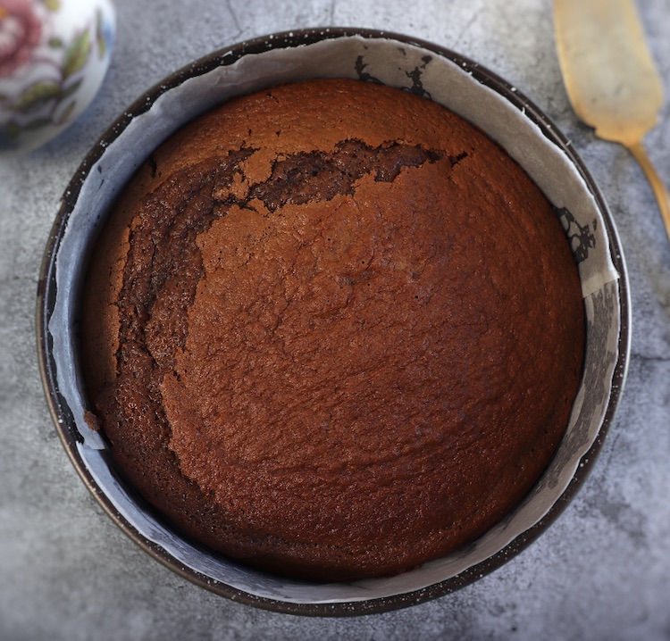 Chocolate coffee cake on a round cake pan