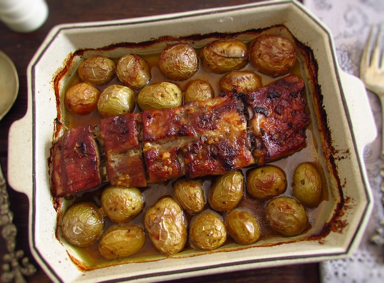 Roasted pork ribs with honey and mustard on a baking dish