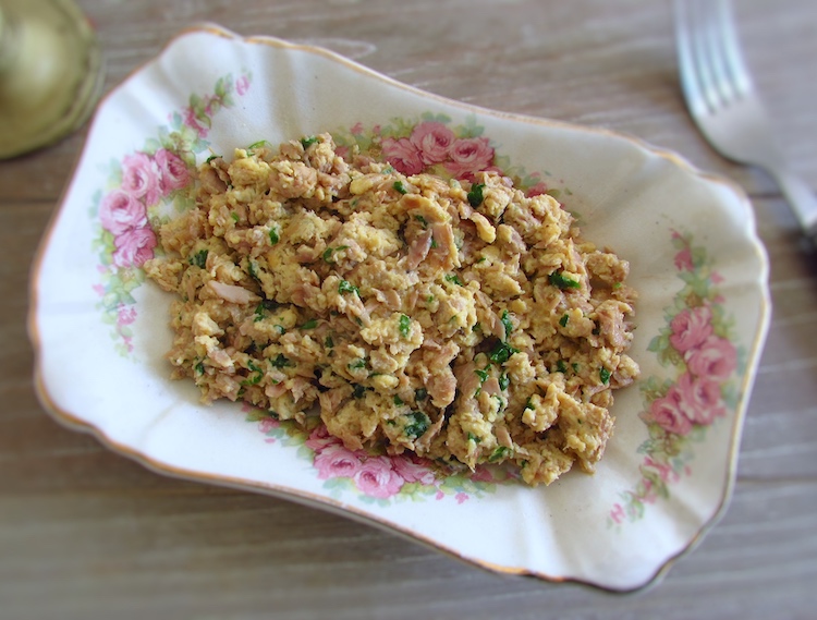 Scrambled eggs with tuna on a small platter