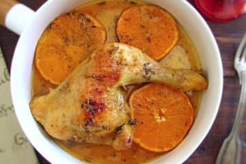 Easy baked chicken legs with orange on a dish bowl
