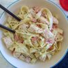 Fried chicken breast with bacon and tagliatelle on a dish bowl