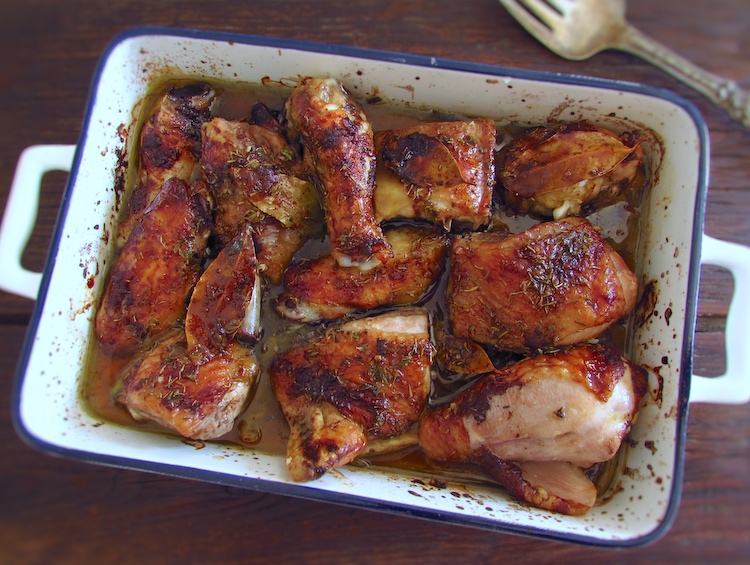 Roasted bittersweet chicken on a baking dish