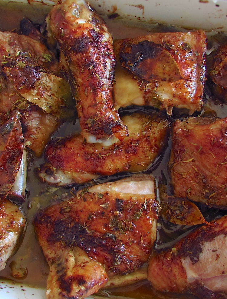 Roasted bittersweet chicken on a baking dish