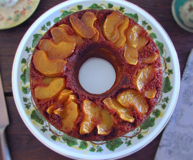 Cinnamon cake with caramelized apple on a plate