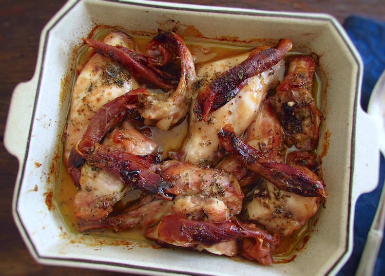 Rabbit with ham in the oven on a baking dish