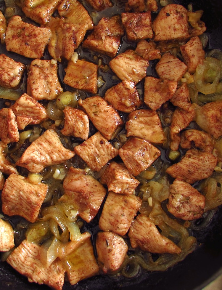 Turkey steaks with lemon, honey and cinnamon on a frying pan