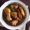 Stewed chicken with spices on a tureen