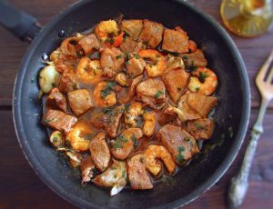 Pork with shrimp on a frying pan