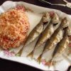 Fried horse mackerel with tomato rice on a platter