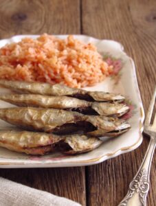 Portuguese Fried Horse Mackerel with Tomato Rice on a serving platter