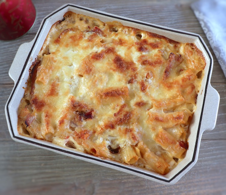 Baked pasta with tuna and ham on a baking dish