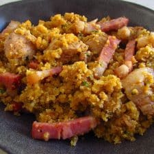 Fried pork with Portuguese cornbread on a plate