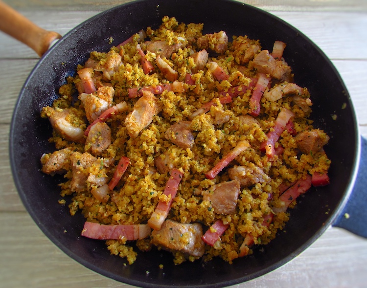 Fried pork with Portuguese cornbread in a frying pan
