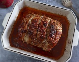 Homemade roasted pork loin on a baking dish